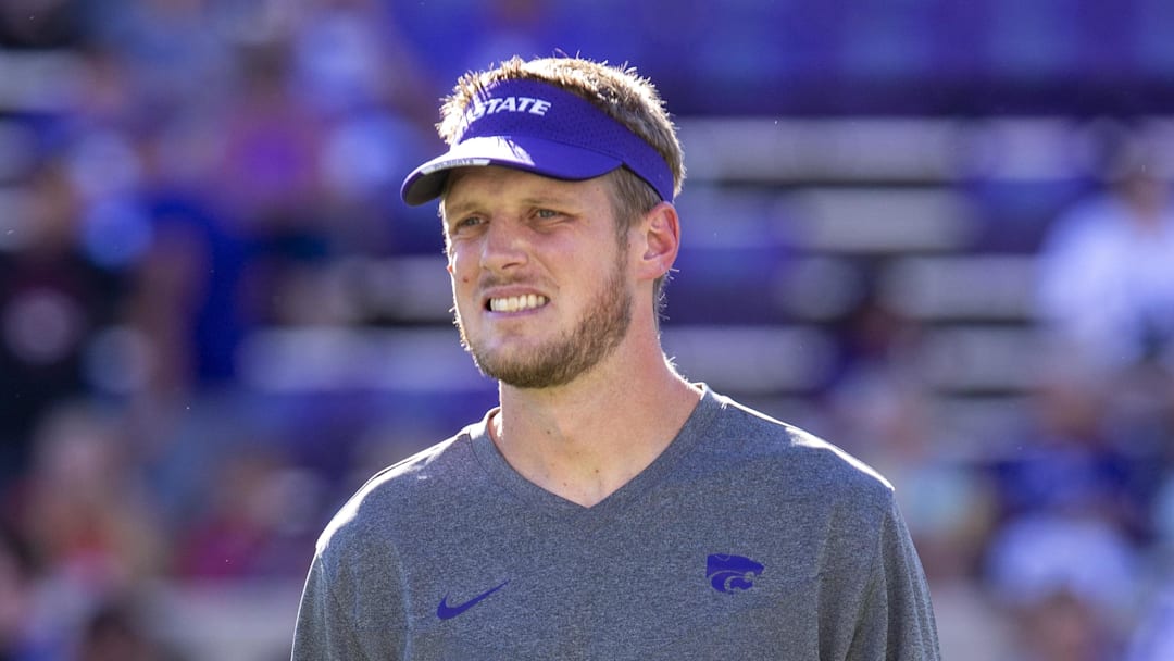 Kansas State Wildcats offensive coordinator Collin Klein watches the team warm up before the start of a game against the South Dakota Coyotes at Bill Snyder Family Football Stadium.