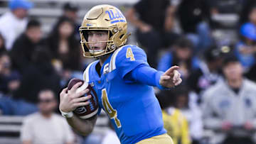 Nov 30, 2024; Pasadena, California, USA; UCLA Bruins quarterback Ethan Garbers (4) scrambles out of the pocket against the Fresno State Bulldogs during the fourth quarter at Rose Bowl. Mandatory Credit: Robert Hanashiro-Imagn Images