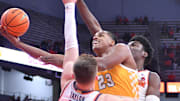 Nov 8, 2023; Syracuse, New York, USA; Canisius Golden Griffins forward Frank Mitchell (23) takes a shot as Syracuse Orange guard Justin Taylor (5) and center Naheem McLeod defend in the first half at the JMA Wireless Dome. Mandatory Credit: Mark Konezny-Imagn Images