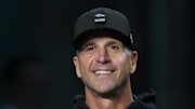 Baltimore Ravens head coach John Harbaugh stands on the sidelines prior to a game against the Miami Dolphins.