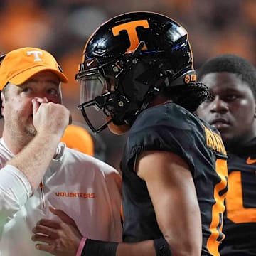 Josh Heupel and Nico Iamaleava talk during a game against Kentucky.