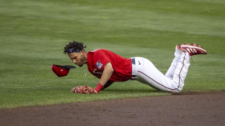 Jul 26, 2021; Minneapolis, Minnesota, USA; Minnesota Twins shortstop Andrelton Simmons (9) dives for