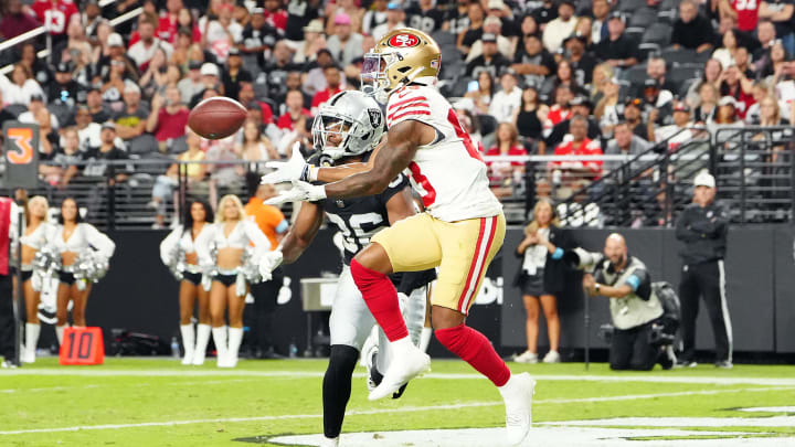 Aug 23, 2024; Paradise, Nevada, USA; San Francisco 49ers wide receiver Jacob Cowing (83) makes a touchdown catch against Las Vegas Raiders cornerback Rayshad Williams (36) during the third quarter at Allegiant Stadium. Mandatory Credit: Stephen R. Sylvanie-USA TODAY Sports