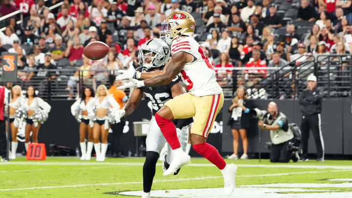 Aug 23, 2024; Paradise, Nevada, USA; San Francisco 49ers wide receiver Jacob Cowing (83) makes a touchdown catch against Las Vegas Raiders cornerback Rayshad Williams (36) during the third quarter at Allegiant Stadium. Mandatory Credit: Stephen R. Sylvanie-USA TODAY Sports