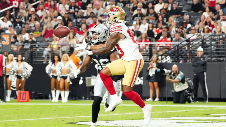 Aug 23, 2024; Paradise, Nevada, USA; San Francisco 49ers wide receiver Jacob Cowing (83) makes a touchdown catch against Las Vegas Raiders cornerback Rayshad Williams (36) during the third quarter at Allegiant Stadium. Mandatory Credit: Stephen R. Sylvanie-USA TODAY Sports