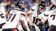 Houston Texans quarterback Graham Mertz (18) hands the ball to running back Dameon Pierce (31) against Detroit Lions during the first half at Ford Field in Detroit on Saturday, August 23, 2025.