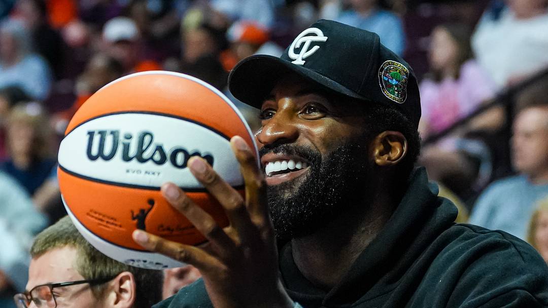 Jun 22, 2026; Uncasville, Connecticut, USA; NBA 76’ers player Andre Drummond on the sideline as the Connecticut Sun take on the Chicago Sky in the first half at Mohegan Sun Arena. Mandatory Credit: David Butler II-Imagn Images