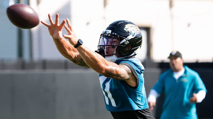 Jacksonville Jaguars wide receiver Parker Washington (11) runs a passing drill during the Jacksonville Jaguars’ third mandatory minicamp Thursday June 12, 2025 at the Miller Electric Center in Jacksonville, Fla. 