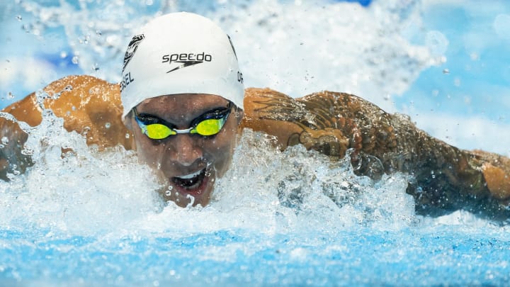 Caeleb Dressel swims Friday, June 21, 2024, in the U.S. Olympic Team Swimming Trials menís 100 meter butterfly prelims at Lucas Oil Stadium in Indianapolis. Mandatory Credit: Mykal McEldowney-USA TODAY Sports