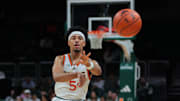 Jan 8, 2025; Coral Gables, Florida, USA; Miami Hurricanes guard Jalen Blackmon (5) passes the basketball against the Florida State Seminoles during the second half at Watsco Center. Mandatory Credit: Sam Navarro-Imagn Images