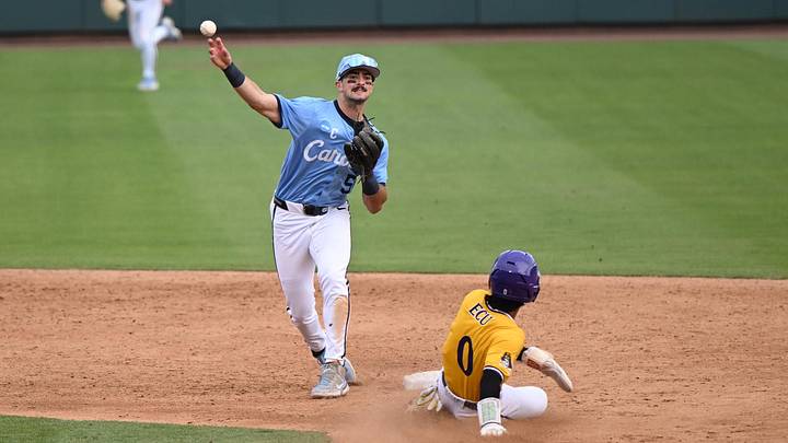 May 30, 2026; Chapel Hill, NC, USA; North Carolina Tar Heels infielder Gavin Gallaher (5) throws to first for a double play during game 4 of the Chapel Hill Regional at Boshamer Stadium. Mandatory Credit: William Howard-Imagn Images
