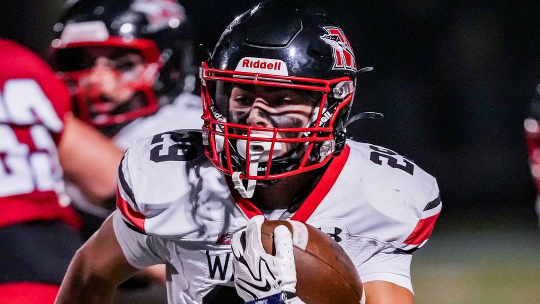 Muskego sophomore running back Jackson Schulz (29) rushes for the corner of the end zone versus Arrowhead during a Classic 8 Conference game on Oct. 2, 2026. 