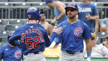 Aug 28, 2024; Pittsburgh, Pennsylvania, USA;  Chicago Cubs right fielder Mike Tauchman (40) greets center fielder Pete Crow-Armstrong (52) crossing home plate to score a run against the Pittsburgh Pirates during the ninth inning at PNC Park. Chicago won 14-10.