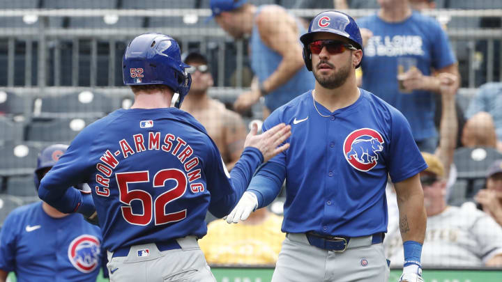 Aug 28, 2024; Pittsburgh, Pennsylvania, USA;  Chicago Cubs right fielder Mike Tauchman (40) greets center fielder Pete Crow-Armstrong (52) crossing home plate to score a run against the Pittsburgh Pirates during the ninth inning at PNC Park. Chicago won 14-10.