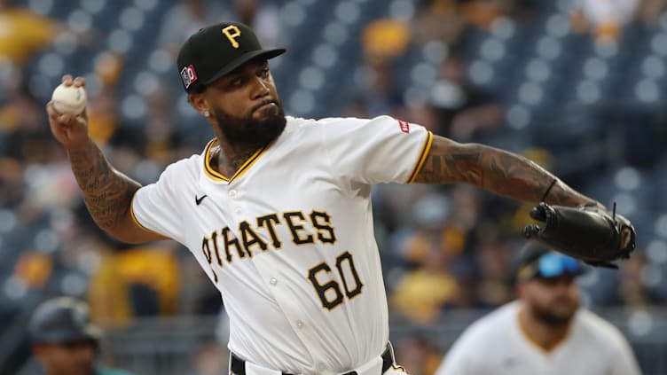 Aug 17, 2024; Pittsburgh, Pennsylvania, USA;  Pittsburgh Pirates relief pitcher Dennis Santana (60) pitches against the Seattle Mariners during the eighth inning at PNC Park. Mandatory Credit: Charles LeClaire-USA TODAY Sports