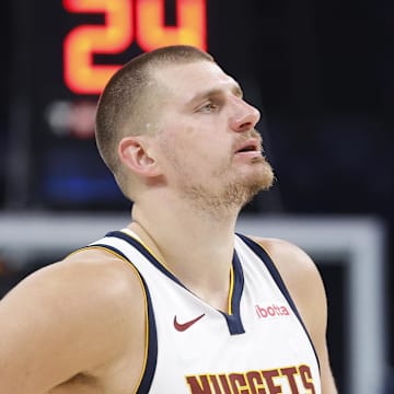 May 18, 2025; Oklahoma City, Oklahoma, USA; Denver Nuggets center Nikola Jokic (15) watches Oklahoma City Thunder guard Shai Gilgeous-Alexander shoot free throws in the second half of game seven of the second round for the 2025 NBA Playoffs at Paycom Center. Mandatory Credit: Alonzo Adams-Imagn Images