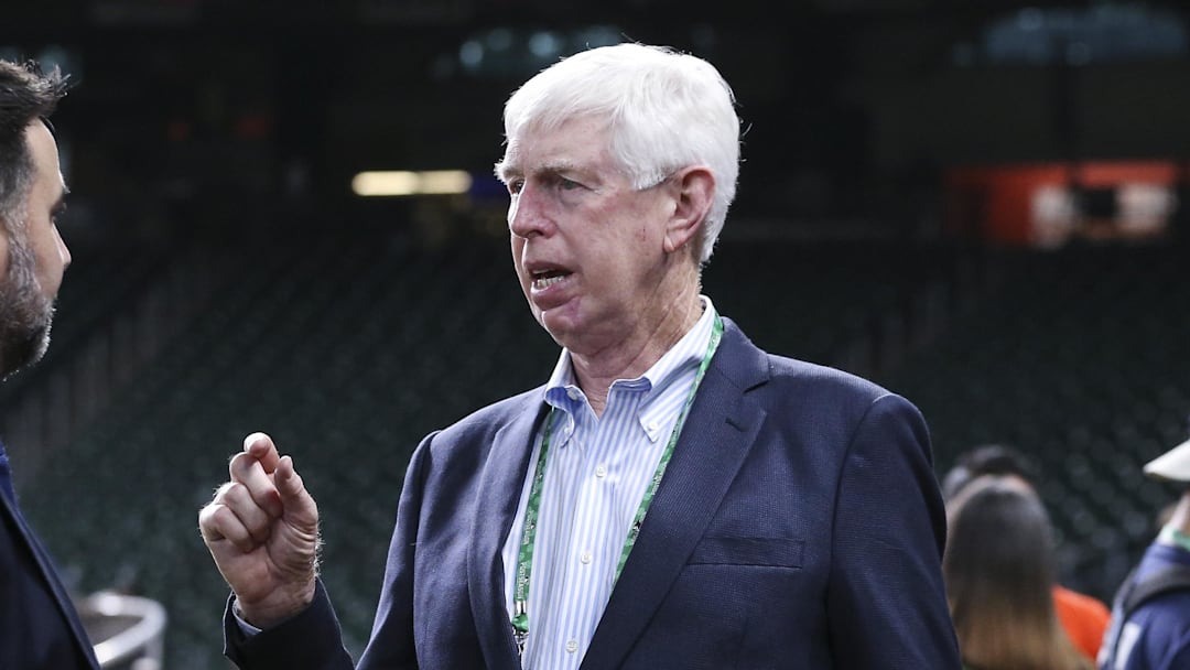 Oct 25, 2021; Houston, Texas, USA;  Atlanta Braves chairman Terry McGuirk (right) talks with general manager Alex Anthopoulos (left) during workouts before Game 1 of the World Series between the Houston Astros and the Atlanta Braves at Minute Maid Park. Mandatory Credit: Troy Taormina-Imagn Images