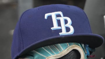 Sep 26, 2025; Toronto, Ontario, CAN; The hat and glove of Tampa Bay Rays third baseman Junior Caminero (13) in the dugout during the game against the Toronto Blue Jays at Rogers Centre.  
