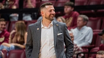 Florida State Seminoles head coach Luke Loucks smiles as his players celebrate. The Florida State Seminoles defeated the Alcorn State Braves 108-76 on Tuesday, Nov. 4, 2025.