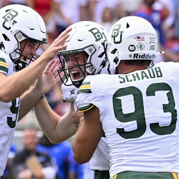 Sep 6, 2025; Dallas, Texas, USA; Baylor Bears punter Palmer Williams (94) and long snapper Dylan Schaub celebrates after place kicker Connor Hawkins (96) makes a game winning field goal to defeat the SMU Mustangs during the second overtime at Gerald J. Ford Stadium. Mandatory Credit: Jerome Miron-Imagn Images