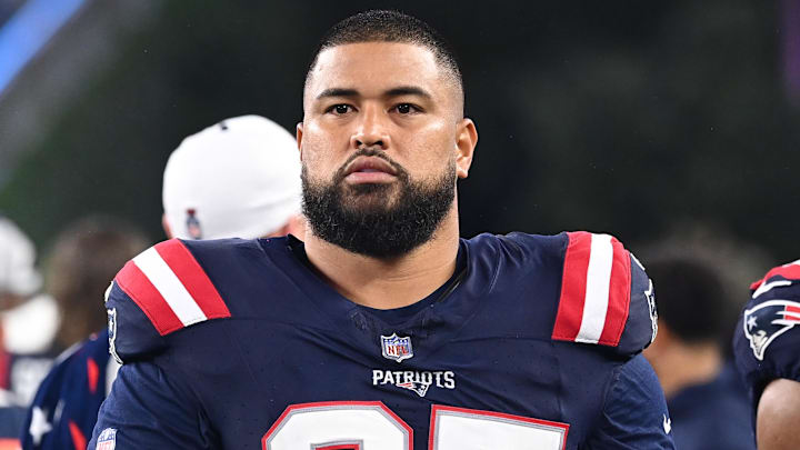 August 8, 2024; Foxborough, MA, USA; New England Patriots defensive tackle Daniel Ekuale (95) watches from the sideline during the first half against the Carolina Panthers at Gillette Stadium. Mandatory Credit: Eric Canha-Imagn Images