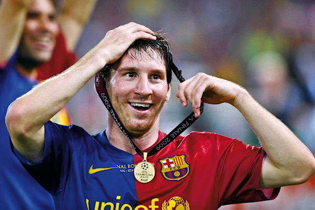 Lionel Messi with his Champions League winners’ medal from 2009.