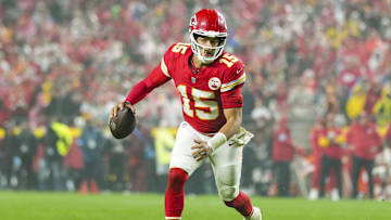 Nov 4, 2024; Kansas City, Missouri, USA; Kansas City Chiefs quarterback Patrick Mahomes (15) rolls out to pass during the second half against the Tampa Bay Buccaneers at GEHA Field at Arrowhead Stadium. Mandatory Credit: Jay Biggerstaff-Imagn Images