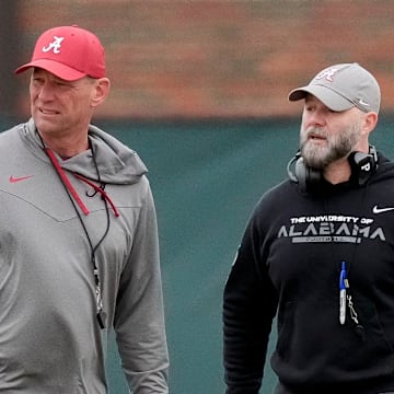 Head coach Kalen DeBoer and Offensive Coordinator Ryan Grubb watch the offense work during Spring Practice for the Crimson Tide.