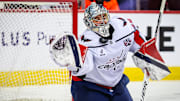 Jan 28, 2025; Calgary, Alberta, CAN; Washington Capitals goaltender Logan Thompson (48) makes a save against the Calgary Flames during the second period at Scotiabank Saddledome. Mandatory Credit: Sergei Belski-Imagn Images
