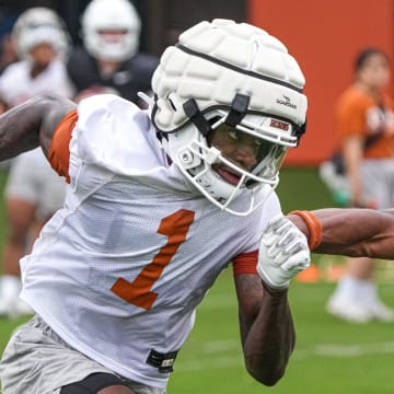 Wide receiver Xavier Worthy (1) runs past defensive back Jahdae Brown (23) during the first Texas Longhorns football practice of 2023 at the Frank Denius Fields on the University of Texas at Austin campus on Monday, March 6, 2023