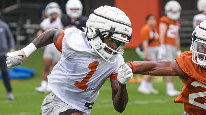 Wide receiver Xavier Worthy (1) runs past defensive back Jahdae Brown (23) during the first Texas Longhorns football practice of 2023 at the Frank Denius Fields on the University of Texas at Austin campus on Monday, March 6, 2023