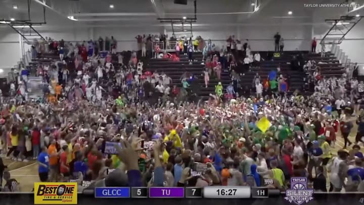 Taylor University students storm the court during the 2023 Silent Night Game.