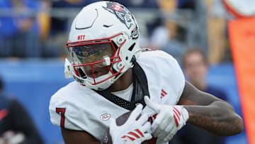 Oct 25, 2025; Pittsburgh, Pennsylvania, USA; North Carolina State Wolfpack tight end Justin Joly (7) catches the ball for a touchdown against the Pittsburgh Panthers during the first quarter at Acrisure Stadium. Mandatory Credit: Charles LeClaire-Imagn Images