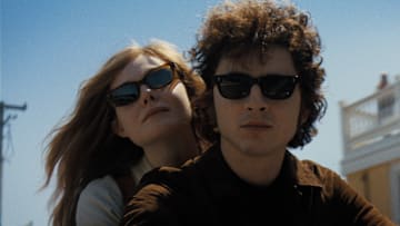 Timothée Chalamet as Bob Dylan and Elle Fanning as Sylvie Russo in A Complete Unknown