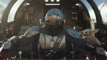 (L-R) Mandalorian (Pedro Pascal) and Grogu in Lucasfilm's THE MANDALORIAN & GROGU. Photo courtesy of Lucasfilm. © 2025 Lucasfilm Ltd™. All Rights Reserved.