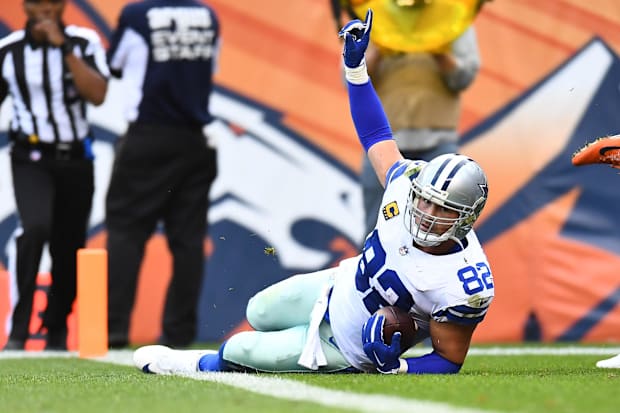 Dallas Cowboys tight end Jason Witten signals his touchdown reception in the second half against the Denver Broncos.