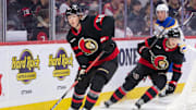 Sep 26, 2024; Ottawa, Ontario, CAN; Ottawa Senators defenseman Carter Yakemchuk (58) controls the puck in the second period against the Buffalo Sabres at the Canadian Tire Centre. Mandatory Credit: Marc DesRosiers-Imagn Images