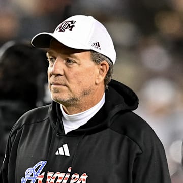 Nov 11, 2023; College Station, Texas, USA; Texas A&M Aggies head coach Jimbo Fisher looks on during warm ups prior to the game against the Mississippi State Bulldogs at Kyle Field. Mandatory Credit: Maria Lysaker-Imagn Images