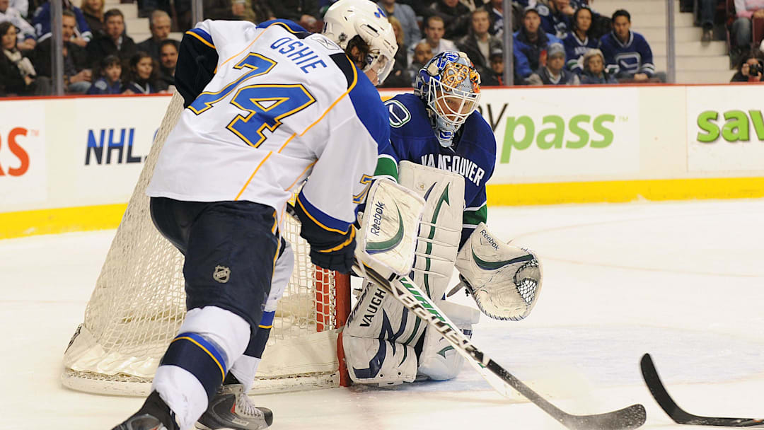 Feb 24, 2011; Vancouver, British Columbia, CANADA;  St. Louis Blues forward TJ Oshie (74) has a scoring chance against Vancouver Canucks goaltender Cory Schneider (35) during the second period at Rogers Arena. Mandatory Credit: Anne-Marie Sorvin-Imagn Images