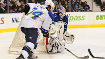 Feb 24, 2011; Vancouver, British Columbia, CANADA;  St. Louis Blues forward TJ Oshie (74) has a scoring chance against Vancouver Canucks goaltender Cory Schneider (35) during the second period at Rogers Arena. Mandatory Credit: Anne-Marie Sorvin-Imagn Images
