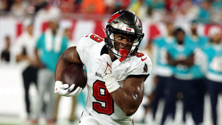 Aug 23, 2024; Tampa, Florida, USA;  Tampa Bay Buccaneers wide receiver Kameron Johnson (9) runs with the ball against the Miami Dolphins during the second quarter at Raymond James Stadium. Mandatory Credit: Kim Klement Neitzel-USA TODAY Sports