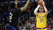 April 5, 2019; Los Angeles, CA, USA; Los Angeles Lakers forward Mike Muscala (31) shoots against Los Angeles Clippers forward Wilson Chandler (22) during the first half at Staples Center. Mandatory Credit: Gary A. Vasquez-Imagn Images