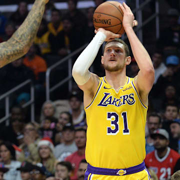 April 5, 2019; Los Angeles, CA, USA; Los Angeles Lakers forward Mike Muscala (31) shoots against Los Angeles Clippers forward Wilson Chandler (22) during the first half at Staples Center. Mandatory Credit: Gary A. Vasquez-Imagn Images