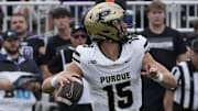 Purdue Boilermakers quarterback Ryan Browne (15) passes the ball