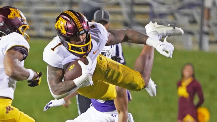 Sep 23, 2023; Evanston, Illinois, USA; Minnesota Golden Gophers running back Darius Taylor (1) leaps over Northwestern Wildcats linebacker Kenny Soares Jr. (35) during the second half at Ryan Field. Mandatory Credit: David Banks-USA TODAY Sports