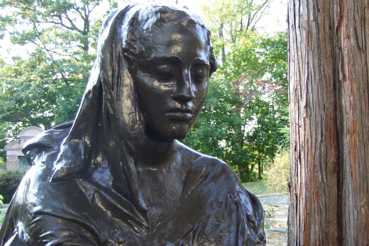 A close-up of the Bronze Lady statue.