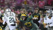 Marco Jones (23), the Bay Area's top recruit from San Ramon Valley, is about to pull down De La Salle's Derrick Blanche Jr., the Bay's No. 43 player.