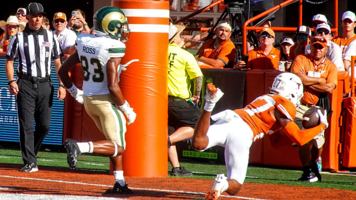 Aug 31, 2024; Austin, Texas, USA; Texas Longhorns defensive back Mack Wardell (27) makes an interception against the Colorado State Rams in the fourth quarter at Darrell K Royal-Texas Memorial Stadium. Mandatory Credit: Aaron Meullion-USA TODAY Sports