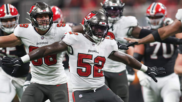 Tampa Bay Buccaneers linebacker K.J. Britt (52) and linebacker Anthony Nelson (98) and defensive tackle Vita Vea (50) 