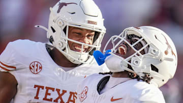 Texas Longhorns wide receiver Silas Bolden (11) and Texas Longhorns defensive back Xavier Filsaime (21) celebrates a touchdown in the third quarter during the Red River Rivalry Football Game between the University of Oklahoma Sooners and the University of Texas Longhorns at the Cotton Bowl Stadium in Dallas, TX Saturday, Oct. 12, 2024.
